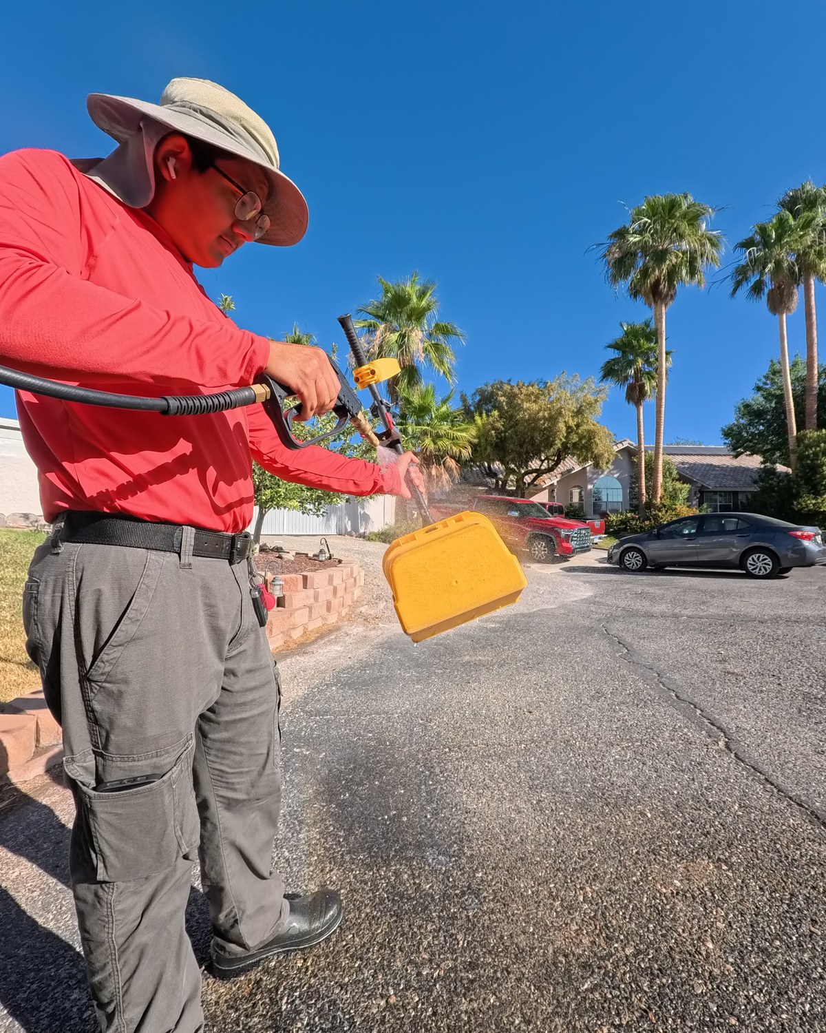 Poop Scoop Dude sanitizing tools and equipment after a yard to prevent spreading disease between homes