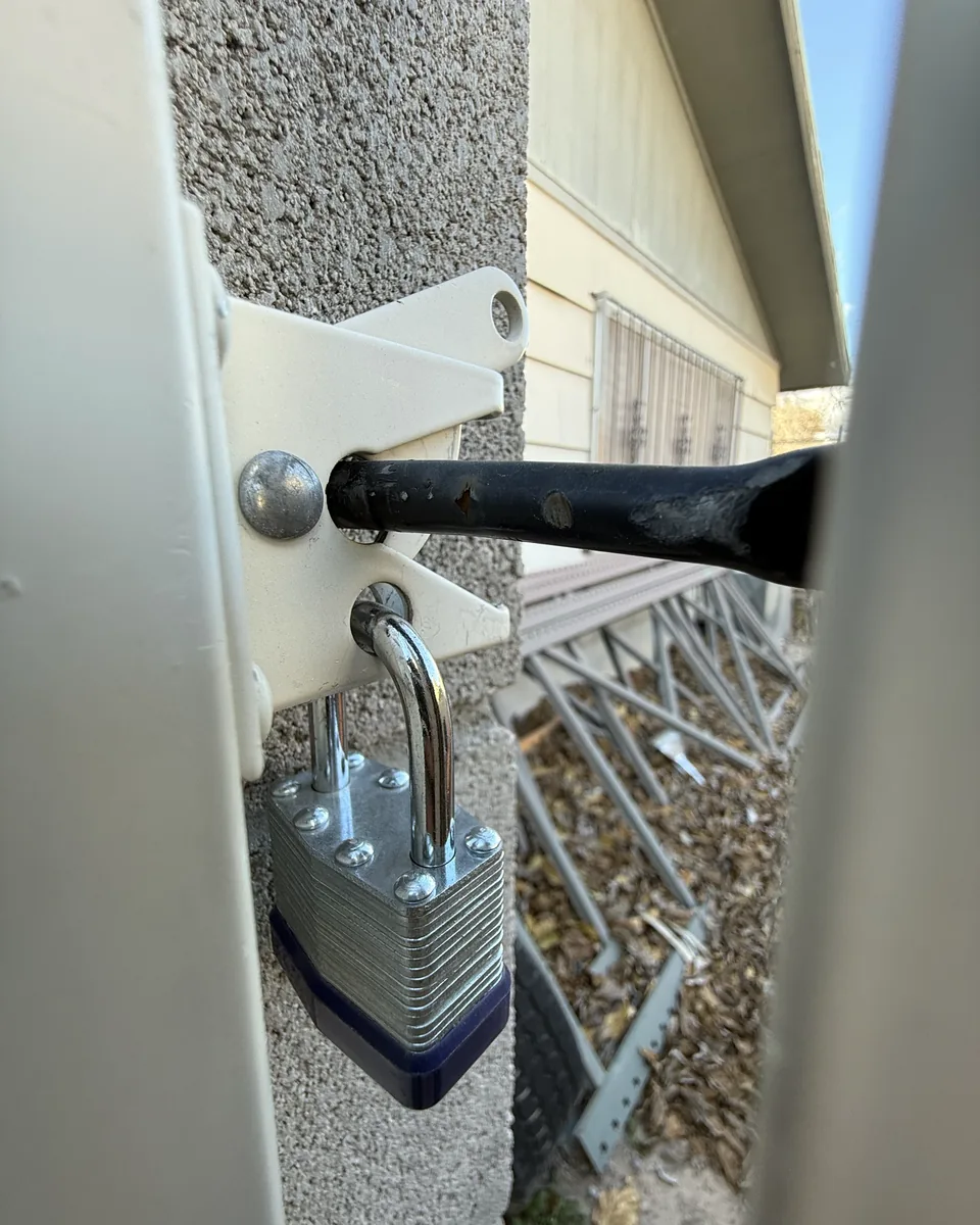 Locked gate photo texted as proof after a Poop Scoop Dude visit