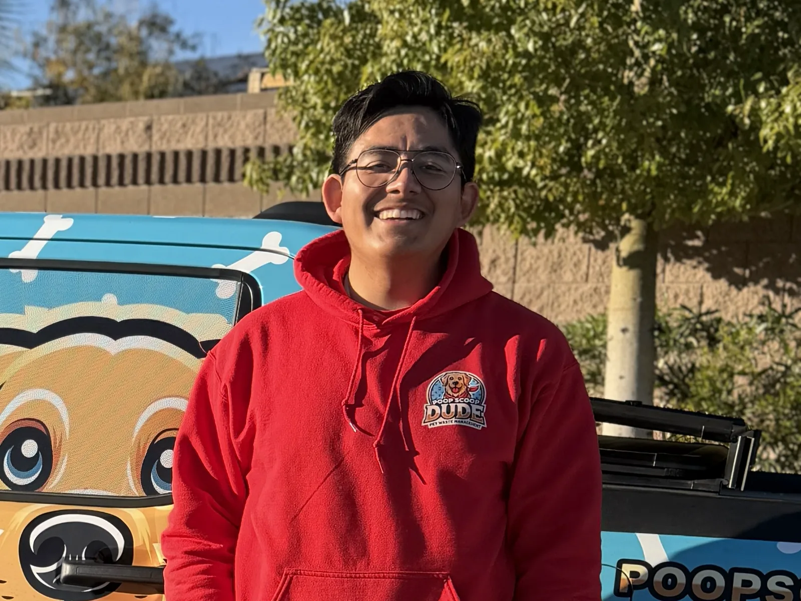 Gianny Rodriguez, who owns Poop Scoop Dude, standing outside in Las Vegas